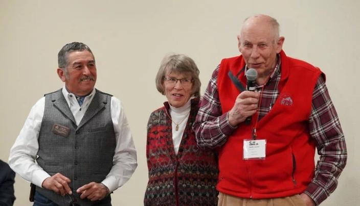 Past SRM President  Dr. J. Alfonso &ldquo;Poncho&rdquo; Ortega listens as Chuck Jarecki and his wife, Penny, present their original concept for the award.