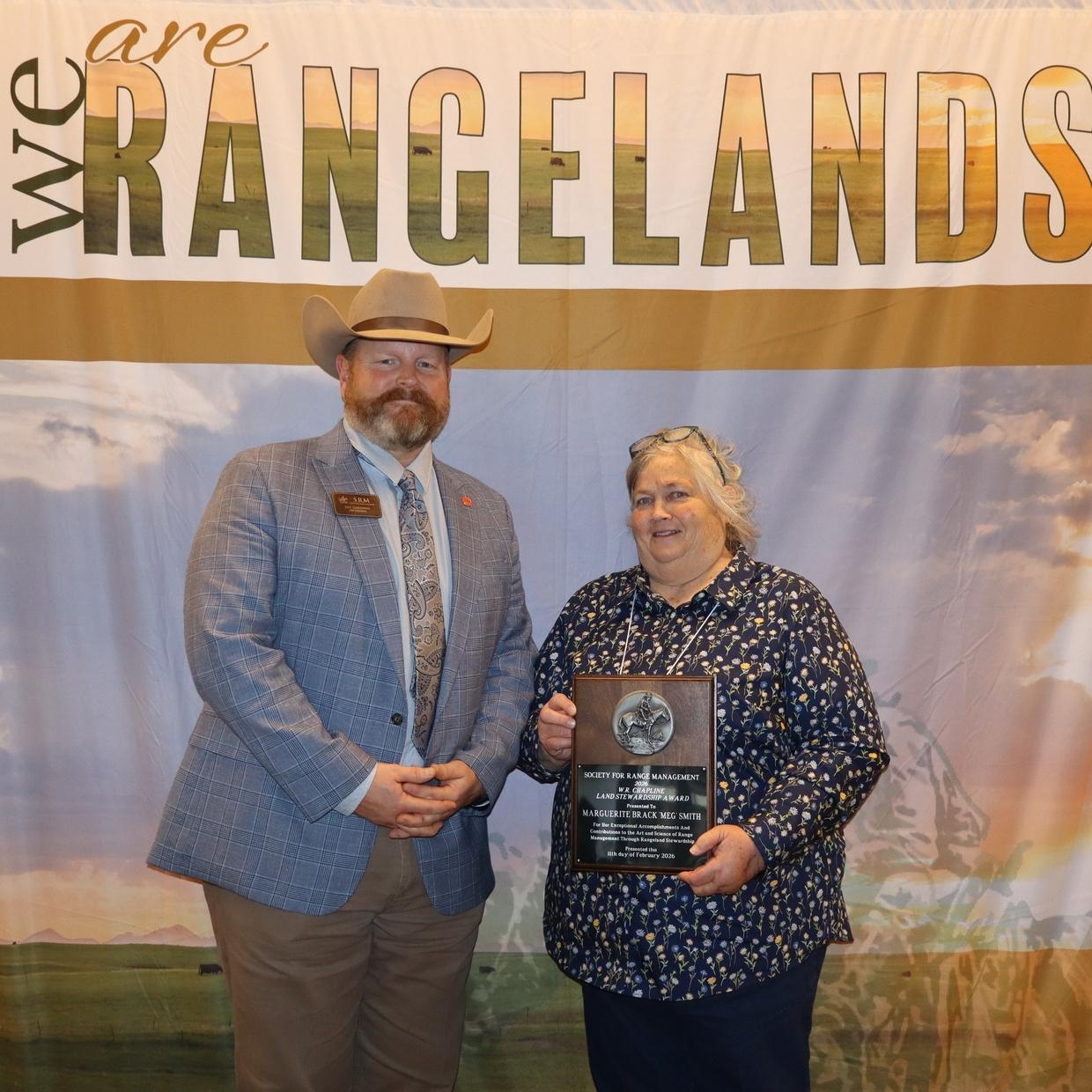 2025 SRM President Jeff Goodwin presents Meg Smith with his honor award at the Annual Meeting in Monterey, California.